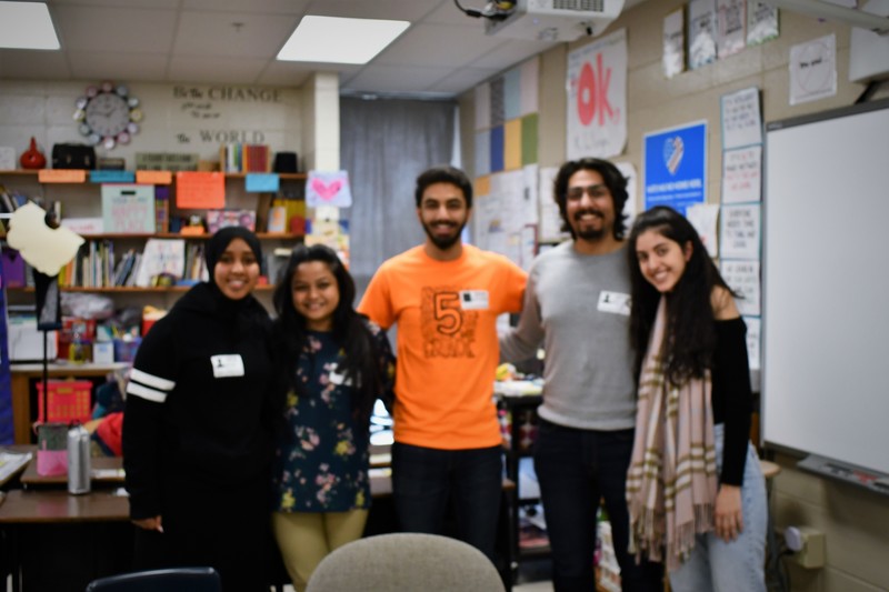 Mr. Shayan Nadeem was a familiar face at Steele last semester when he completed his student teaching in Ms. Hellenga's 5th grade classroom. Nadeem returned to Steele on Friday, February 28 and brought some of his fellow Knox classmates along with him to have conversations with Steele students.   Nadeem who is from Pakistan, brought along with him, Knox students from Pakistan, Bangladesh, Colorado and Syria. The purpose of the visit was simple, have conversations with current 5th grade students during Social Studies. The Knox students were able to join all three of the 5th grade classes and answer questions from the Steele students.   Overheard questions included, "What are the hospitals like in Pakistan, Where else have you traveled before, What other languages do you speak?" Knox college student, Leen Alshalabi, wrote the first name of each student name in Arabic for students to take with them.   When asked why the conversations are important, Nadeem said, "For students to learn the similarities between people who come from different parts of the world. To break down barriers and challenge stereotypes."  The 5th grade students were inquisitive and didn't want the time to end, the conversations could have continued long after the class time was over.   Thank you, Shayan, Iesha, Musa, Sanjana and Leen! The time you spent at Steele was appreciated! 